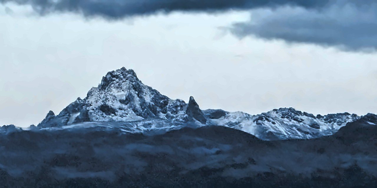 Batian, Nelion and Point Lenana on Mount Kenya at dusk, seen from the Nanyuki side